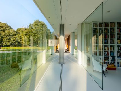 An Elegant and Captivating Modern Transparent House Behind a Grove of Trees in Bontebok, The Netherlands by Inbo (14)