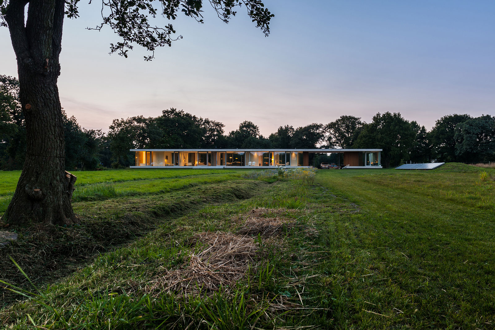 An Elegant and Captivating Modern Transparent House Behind a Grove of Trees in Bontebok, The Netherlands by Inbo (16)