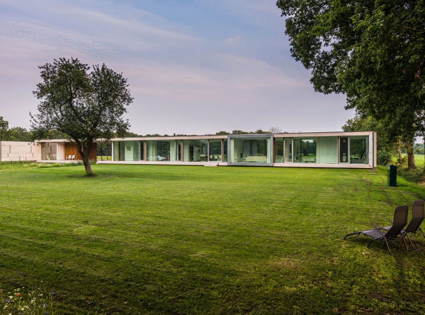 An Elegant and Captivating Modern Transparent House Behind a Grove of Trees in Bontebok, The Netherlands by Inbo (2)