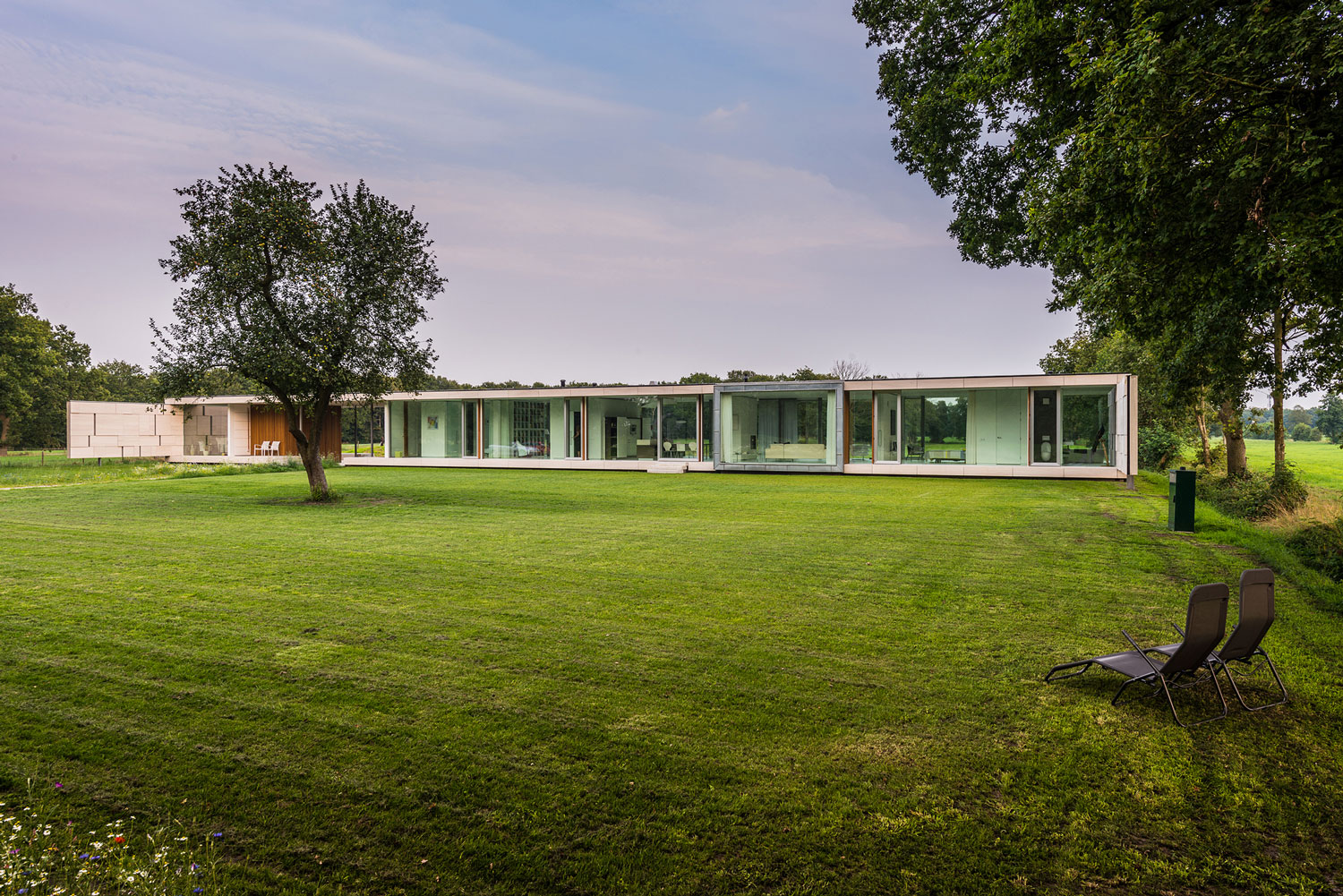 An Elegant and Captivating Modern Transparent House Behind a Grove of Trees in Bontebok, The Netherlands by Inbo (2)