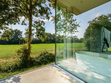 An Elegant and Captivating Modern Transparent House Behind a Grove of Trees in Bontebok, The Netherlands by Inbo (7)