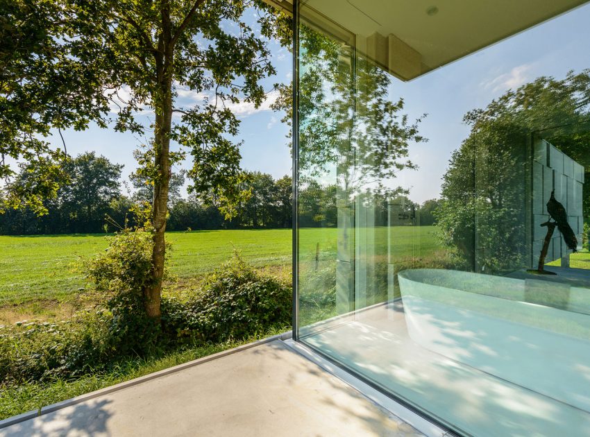 An Elegant and Captivating Modern Transparent House Behind a Grove of Trees in Bontebok, The Netherlands by Inbo (7)