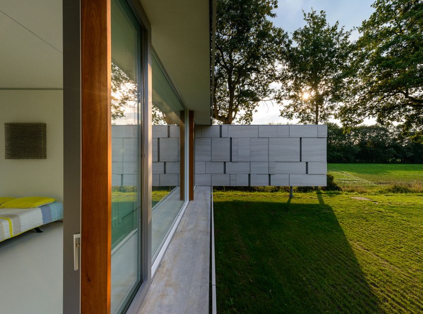 An Elegant and Captivating Modern Transparent House Behind a Grove of Trees in Bontebok, The Netherlands by Inbo (8)