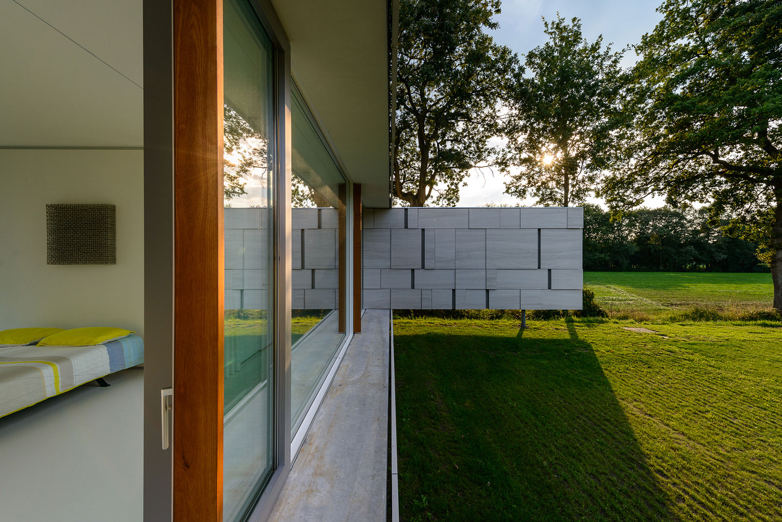 An Elegant and Captivating Modern Transparent House Behind a Grove of Trees in Bontebok, The Netherlands by Inbo (8)