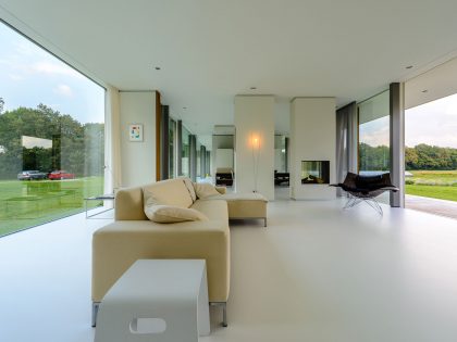 An Elegant and Captivating Modern Transparent House Behind a Grove of Trees in Bontebok, The Netherlands by Inbo (9)