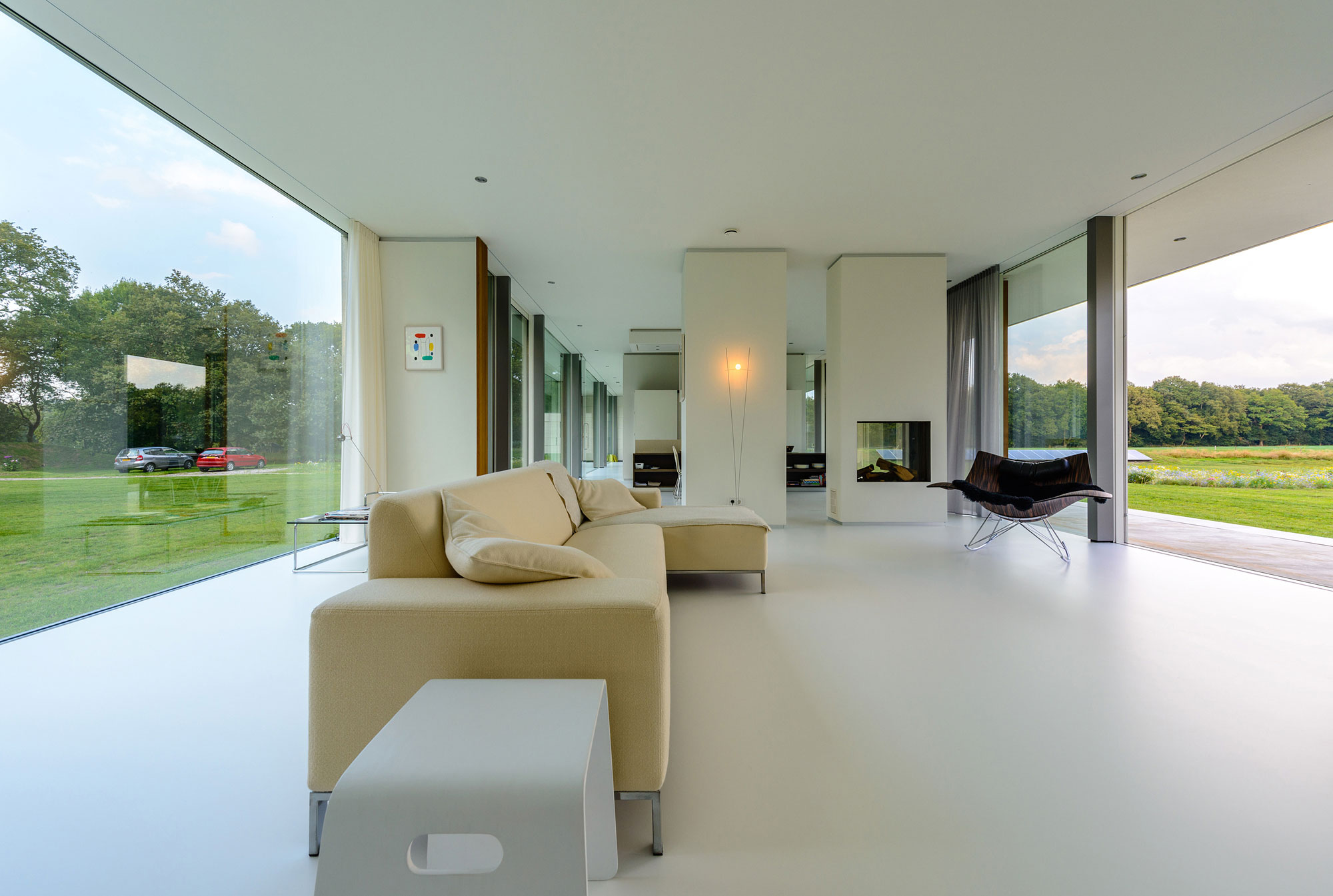 An Elegant and Captivating Modern Transparent House Behind a Grove of Trees in Bontebok, The Netherlands by Inbo (9)