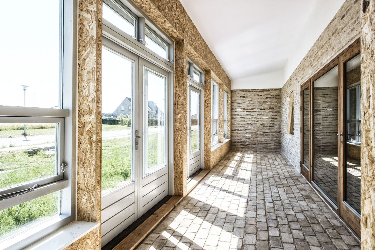 A Warm Contemporary Home Made From Recycled Shipping Containers Materials in Nyborg, Denmark by Lendager Arkitekter (10)