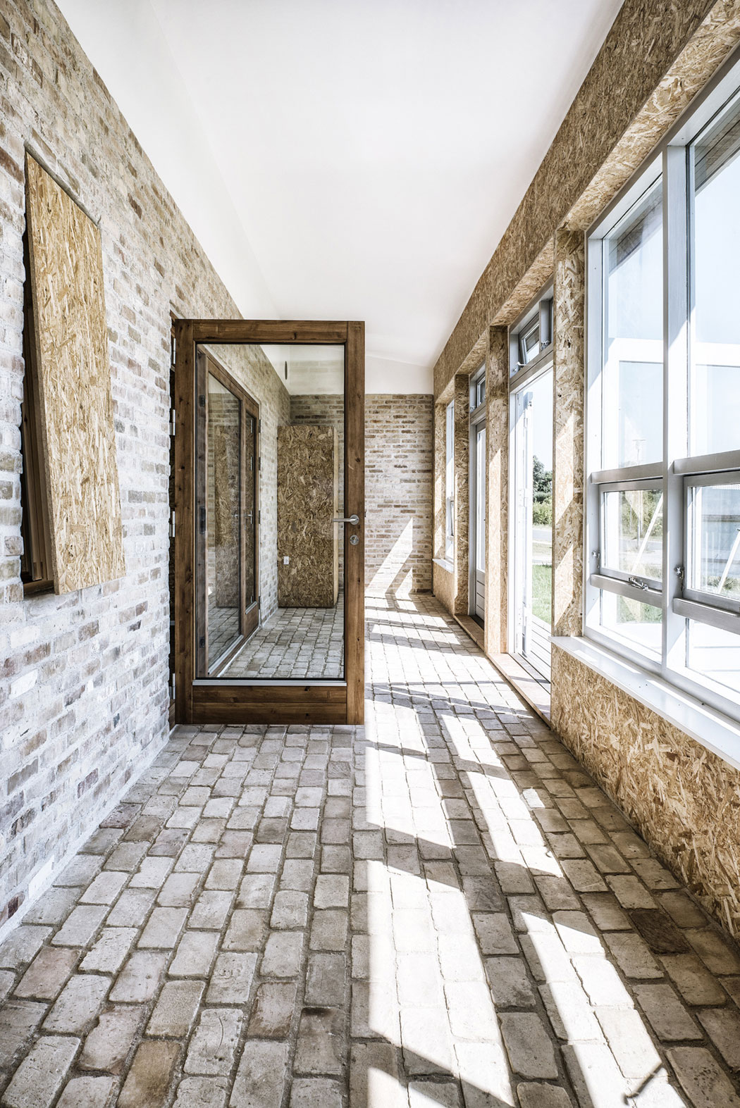 A Warm Contemporary Home Made From Recycled Shipping Containers Materials in Nyborg, Denmark by Lendager Arkitekter (11)