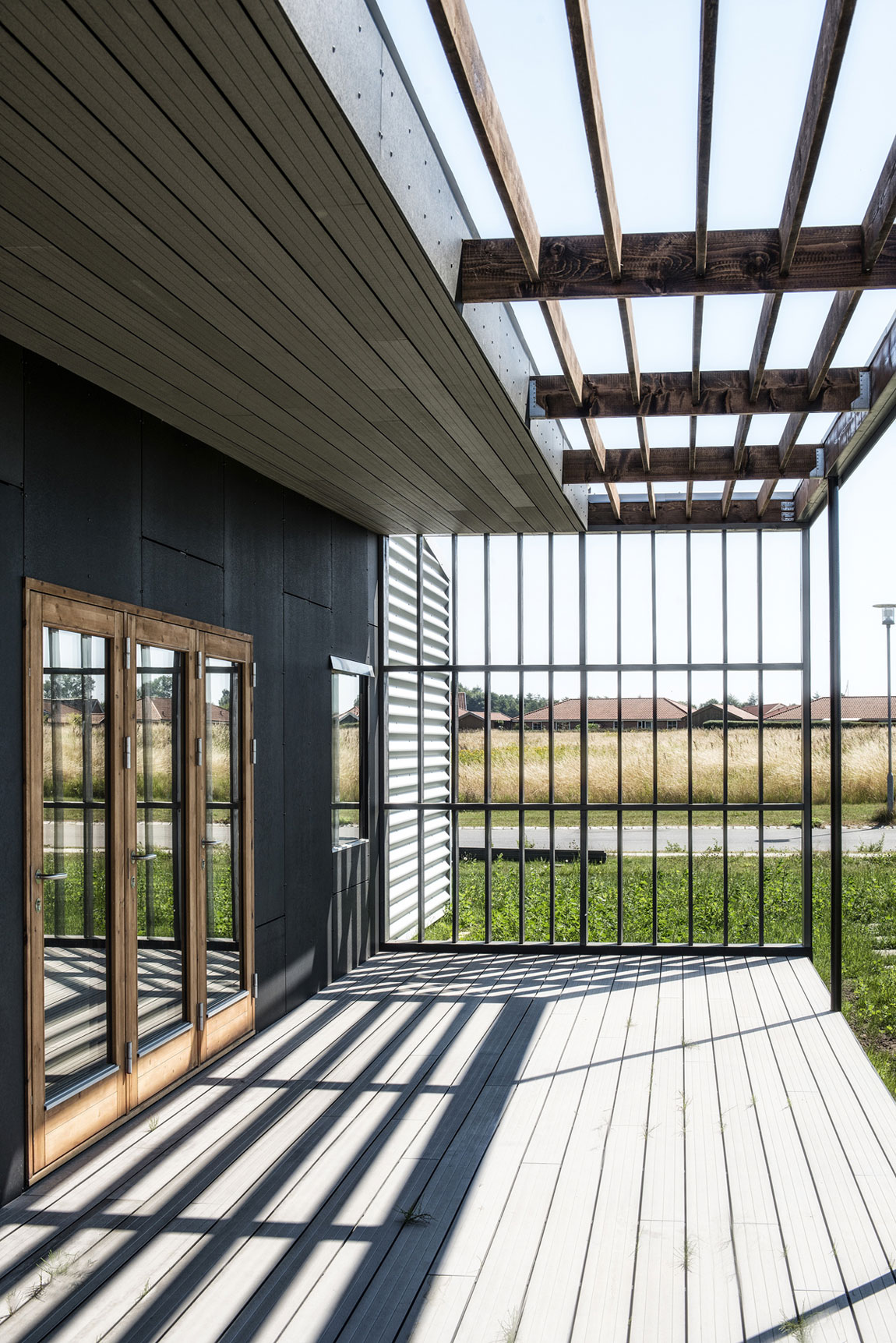 A Warm Contemporary Home Made From Recycled Shipping Containers Materials in Nyborg, Denmark by Lendager Arkitekter (7)