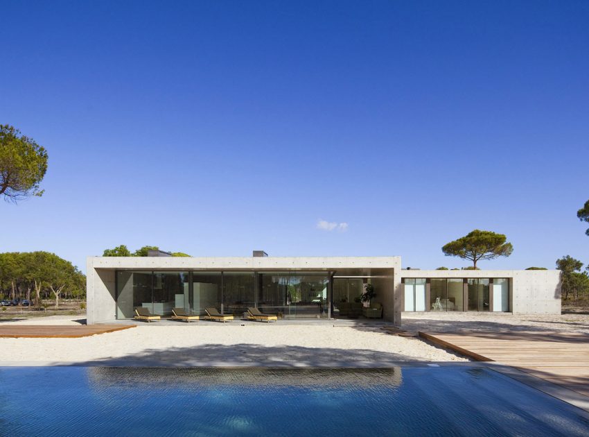 An Elegant Concrete and Glass Home with Warm and Cozy Interior in Comporta, Portugal by RRJ Arquitectos (1)