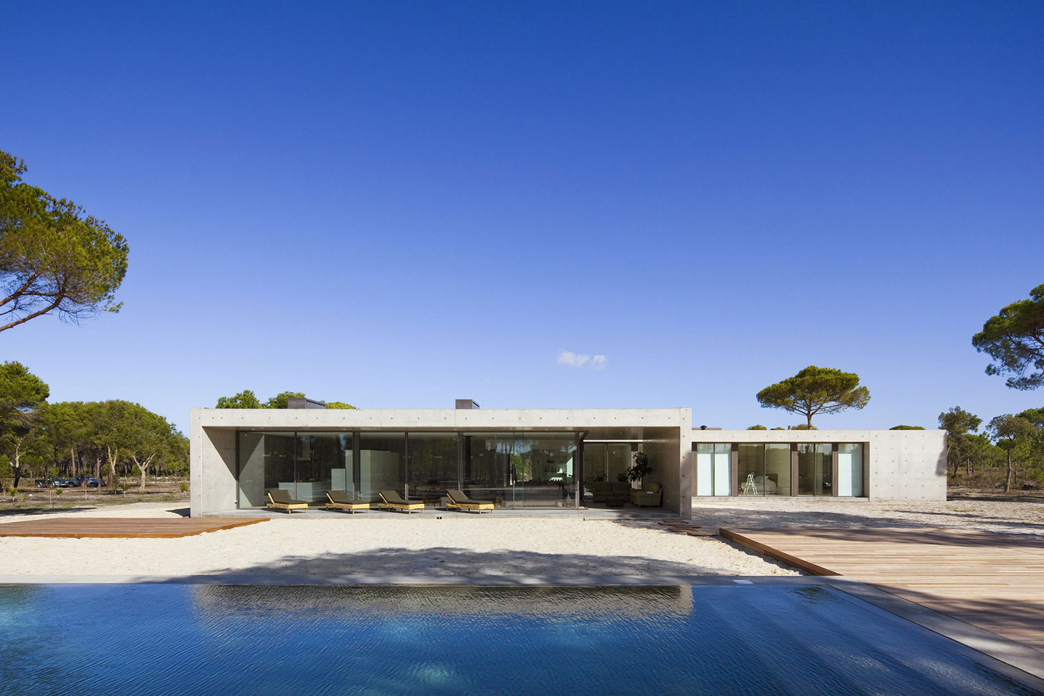 An Elegant Concrete and Glass Home with Warm and Cozy Interior in Comporta, Portugal by RRJ Arquitectos (1)