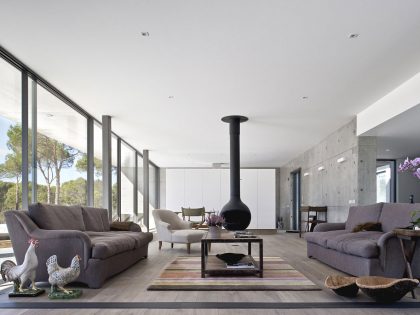 An Elegant Concrete and Glass Home with Warm and Cozy Interior in Comporta, Portugal by RRJ Arquitectos (10)