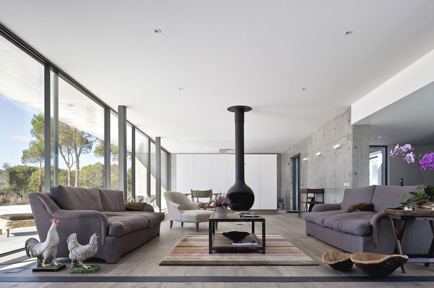 An Elegant Concrete and Glass Home with Warm and Cozy Interior in Comporta, Portugal by RRJ Arquitectos (10)