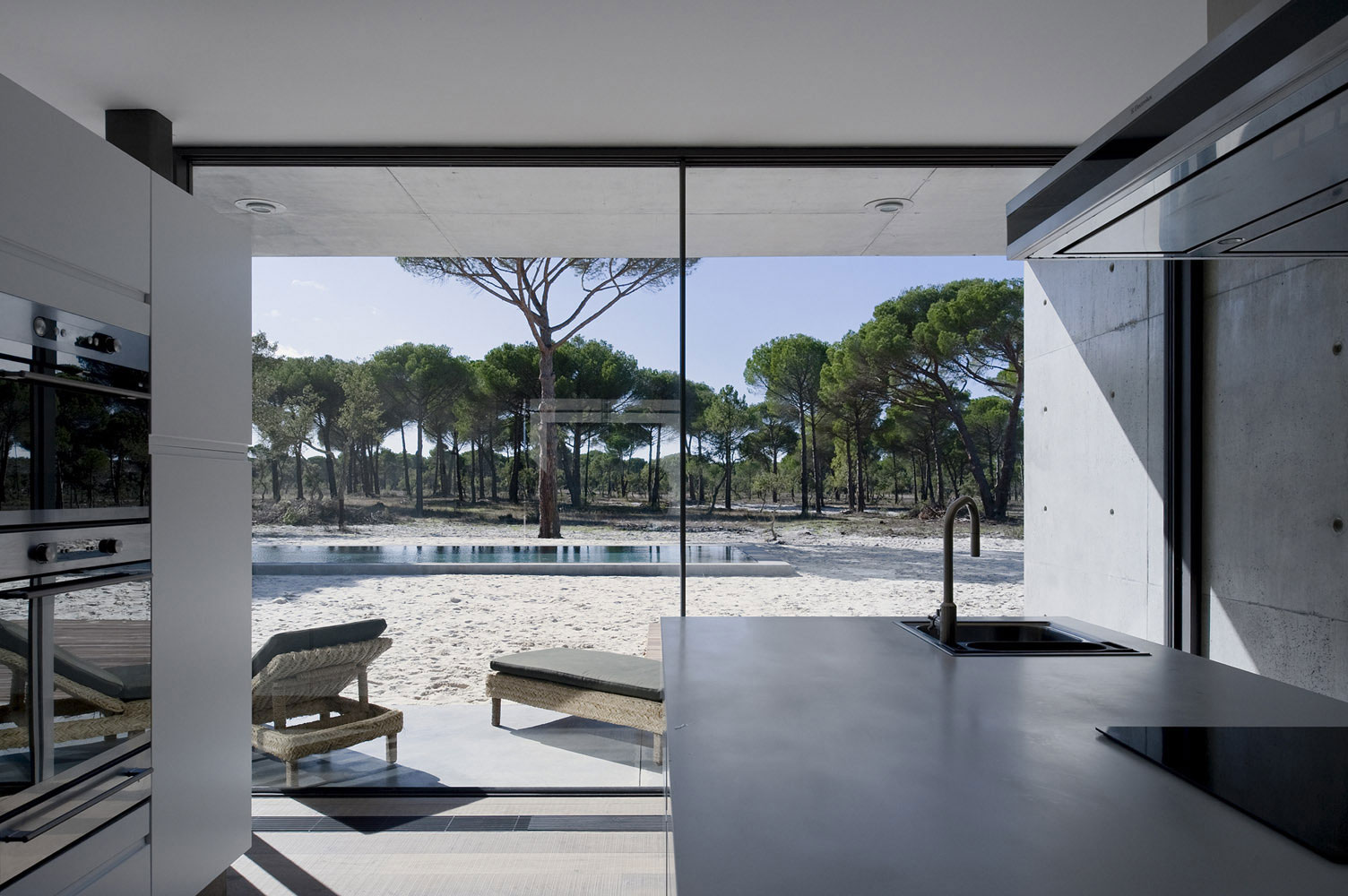 An Elegant Concrete and Glass Home with Warm and Cozy Interior in Comporta, Portugal by RRJ Arquitectos (11)