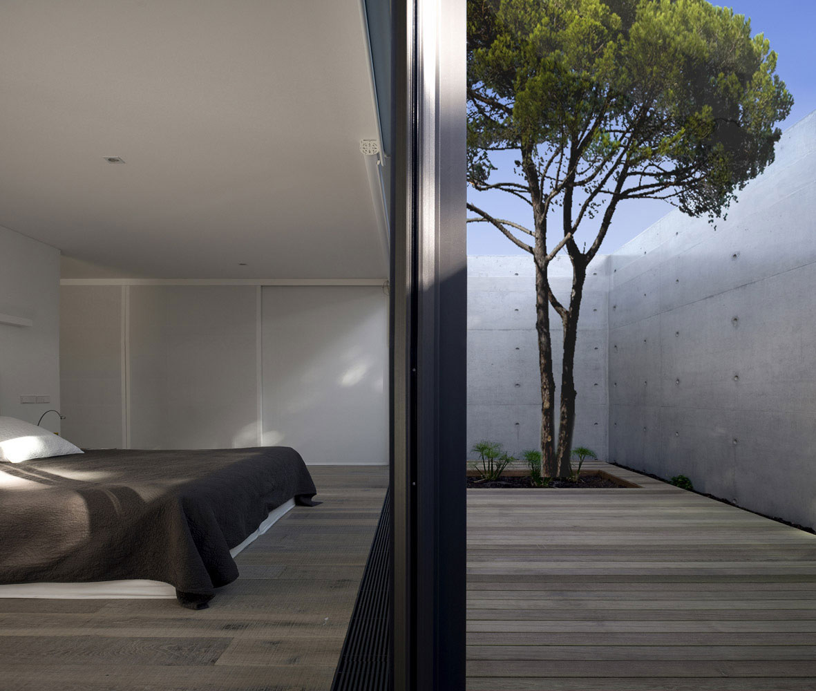 An Elegant Concrete and Glass Home with Warm and Cozy Interior in Comporta, Portugal by RRJ Arquitectos (12)