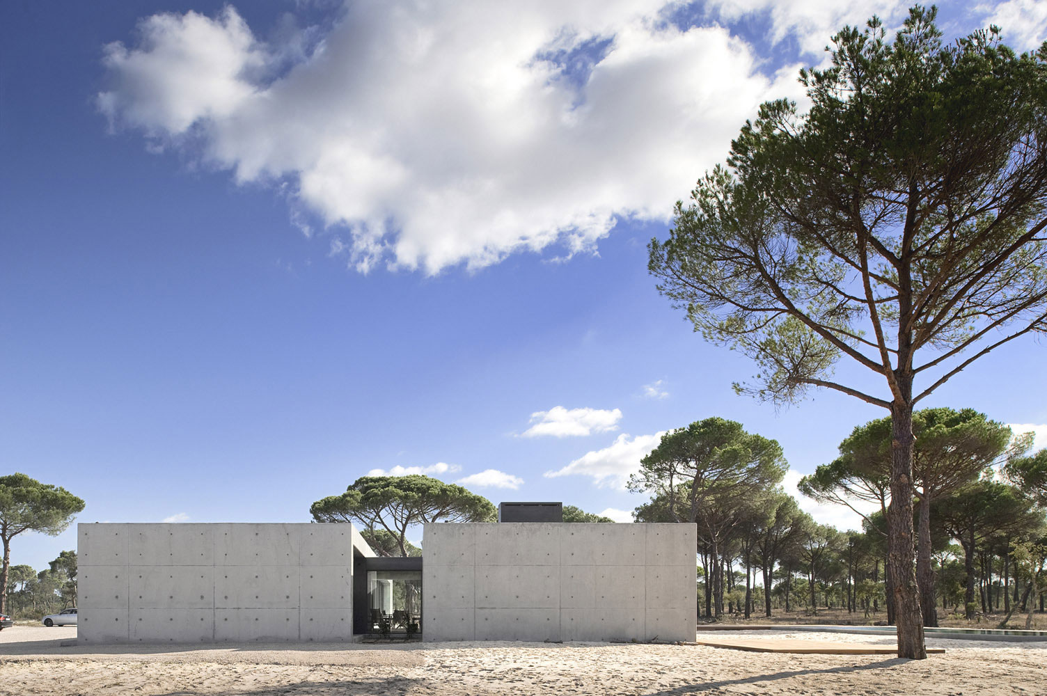 An Elegant Concrete and Glass Home with Warm and Cozy Interior in Comporta, Portugal by RRJ Arquitectos (5)