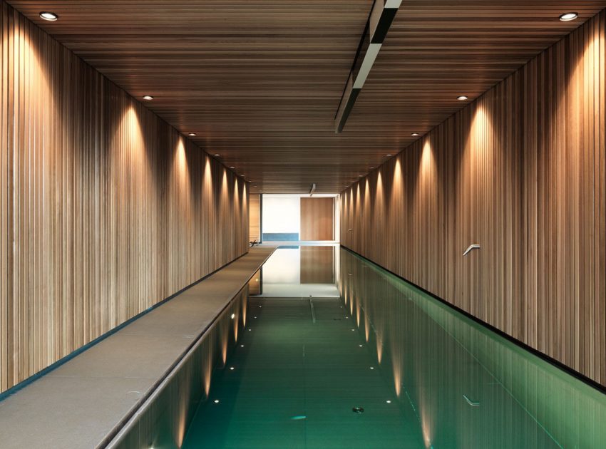 An Elegant Contemporary Home with a Long Swimming Pool in Fribourg, Switzerland by Ralph Germann Architectes (10)