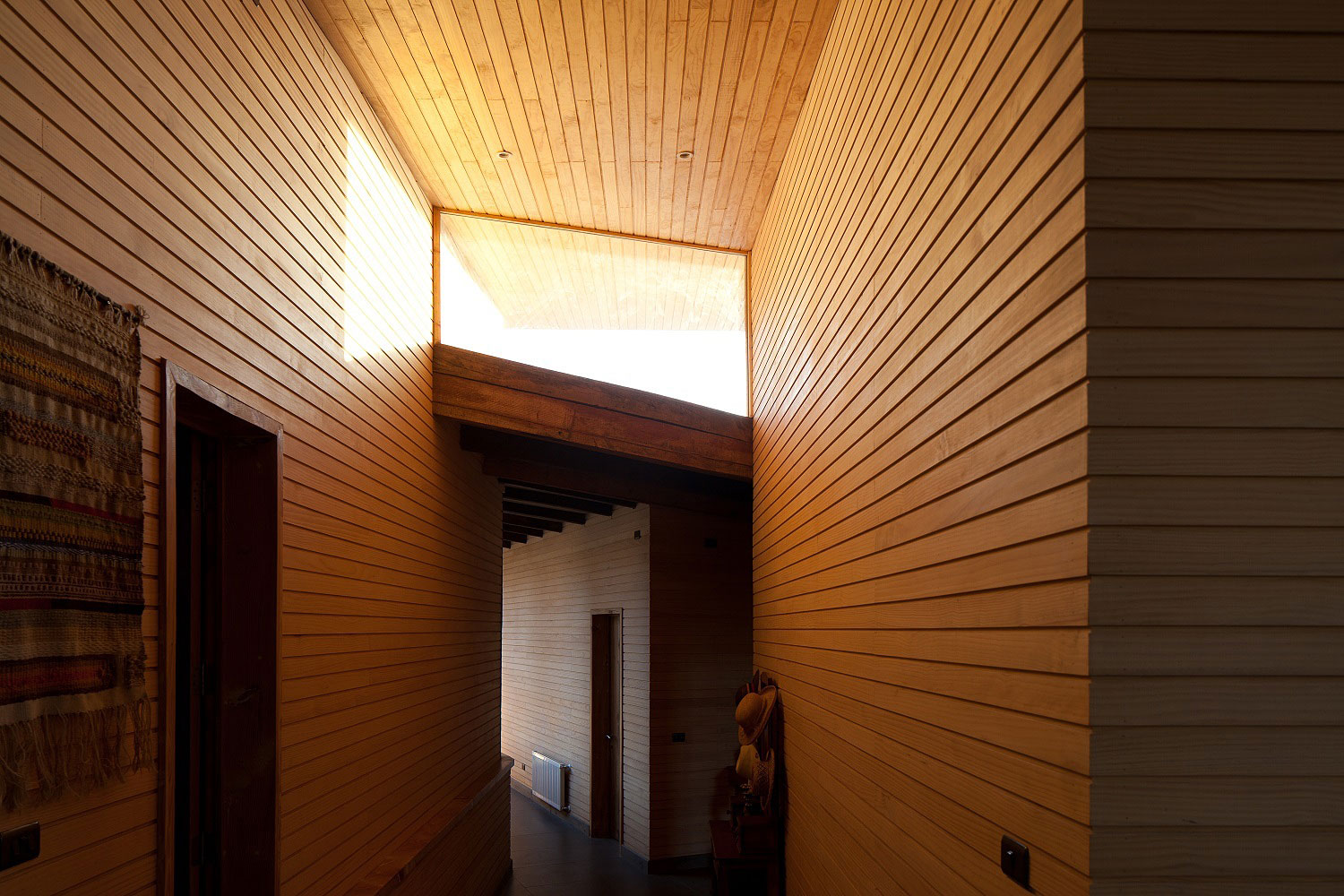 An Exquisite Contemporary Home with an Exterior Made of Recycled Wood Paneling in Panquehue by Dörr + Schmidt (7)