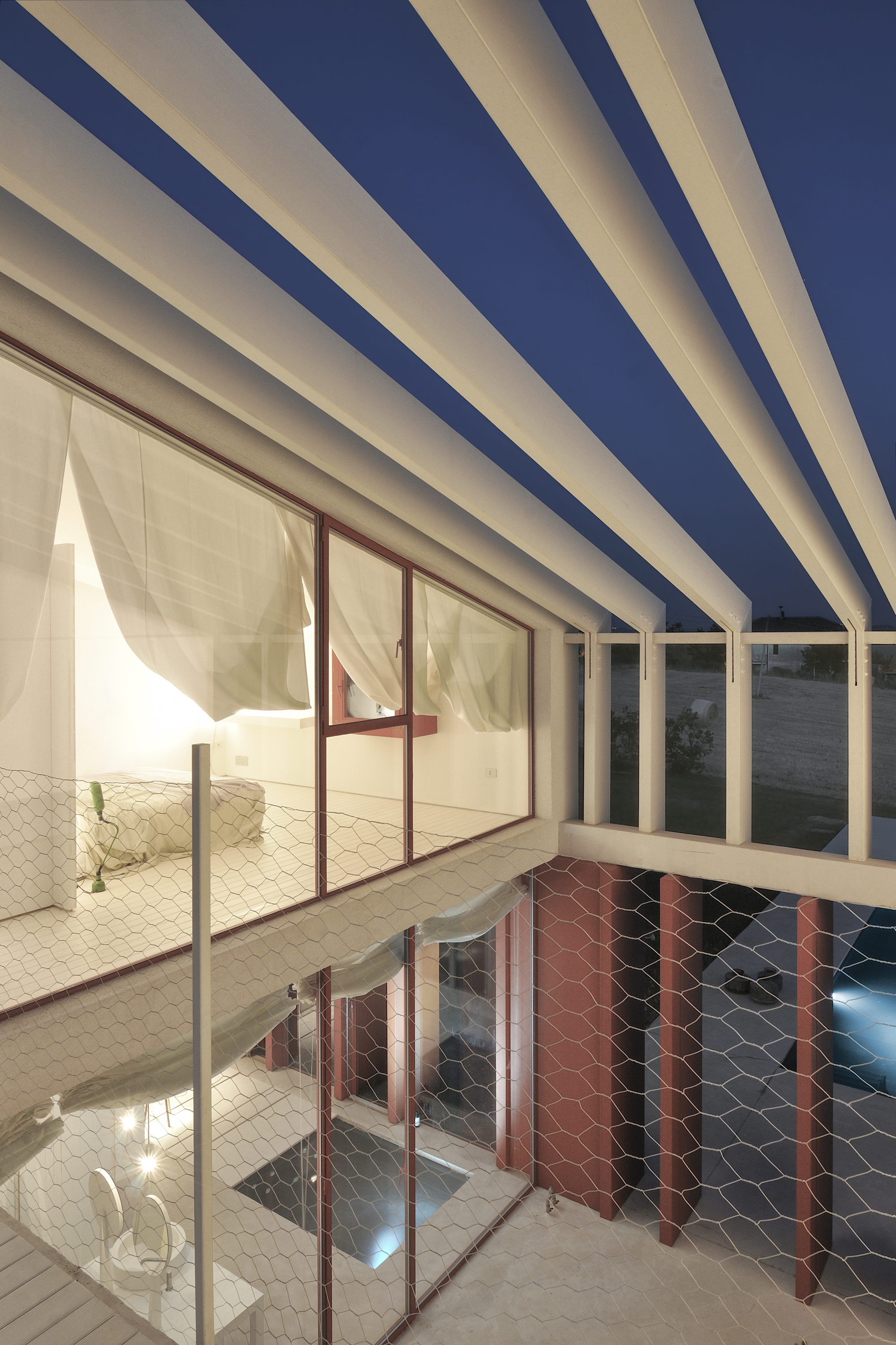 A Bright Long and Narrow Home with Contemporary and Permeable Facade in Polverigi, Italy by simone subissati architects (11)