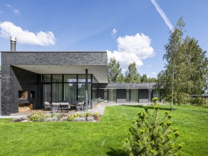 A Bright Modern L-Shaped Home Blends with Stunning Natural Surroundings in Vilnius, Lithuania