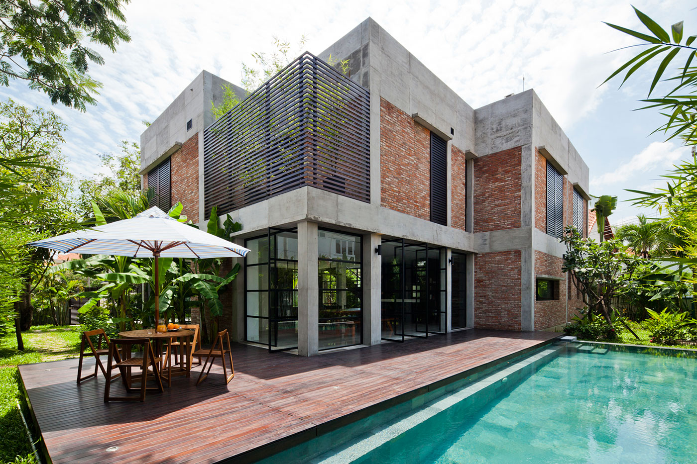 A Contemporary Home with Recycled Bricks, Concrete and Steel Frame Windows in Thao Dien by MM ++ Architects (1)