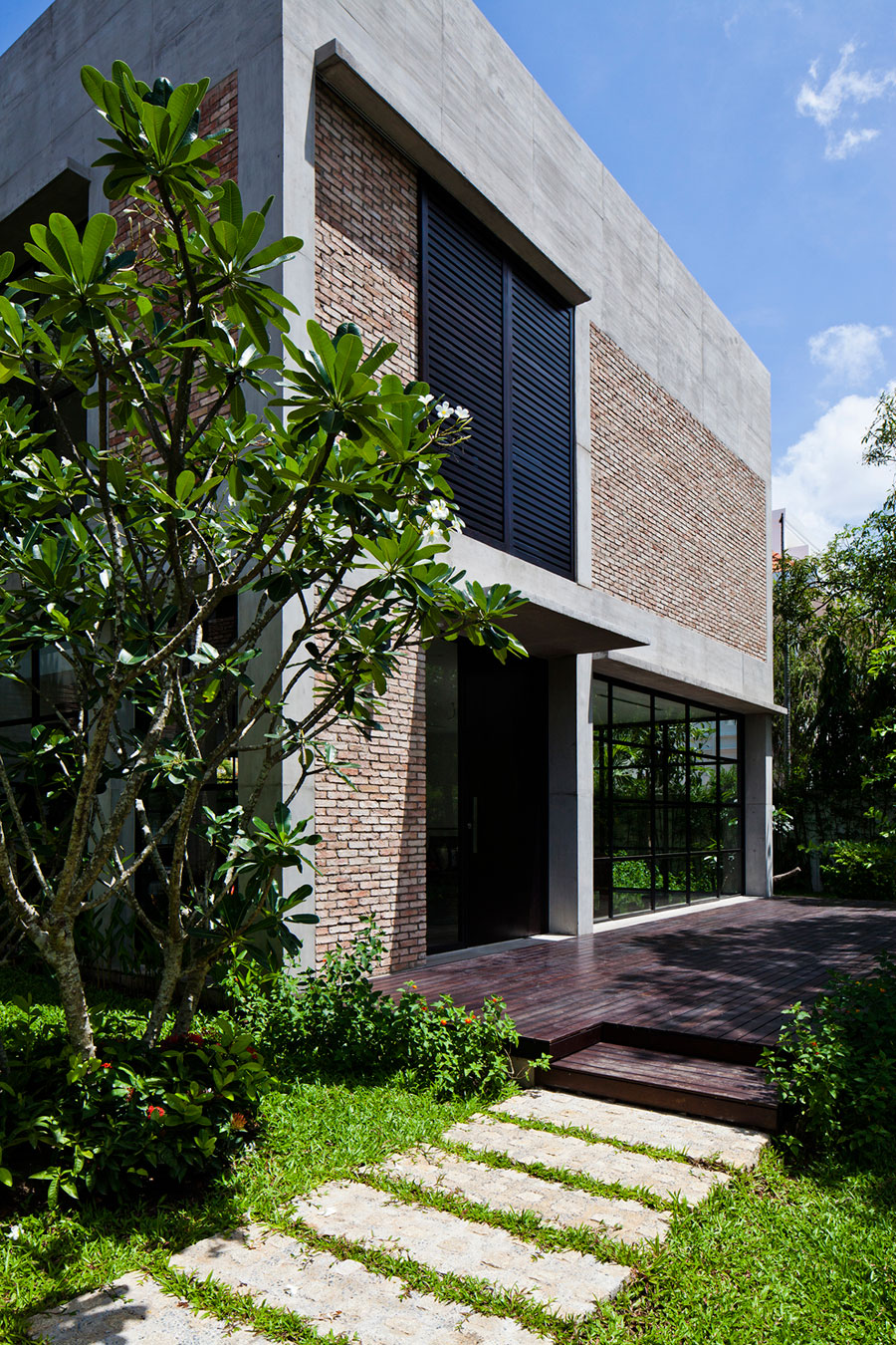 A Contemporary Home with Recycled Bricks, Concrete and Steel Frame Windows in Thao Dien by MM ++ Architects (5)