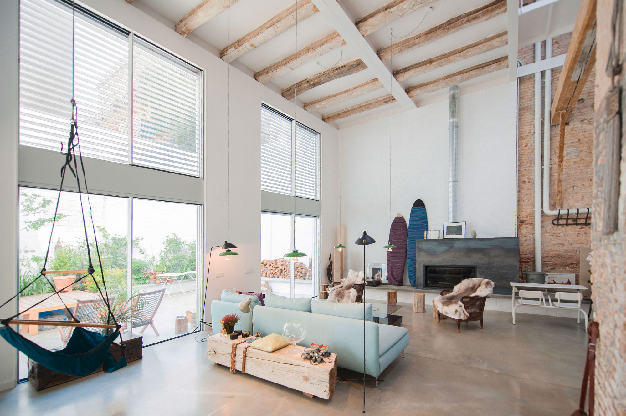 A Former Milk Shop Turned into a Bright Modern Industrial Home in Barcelona by Lluís Corbella & Marc Mazeres (1)