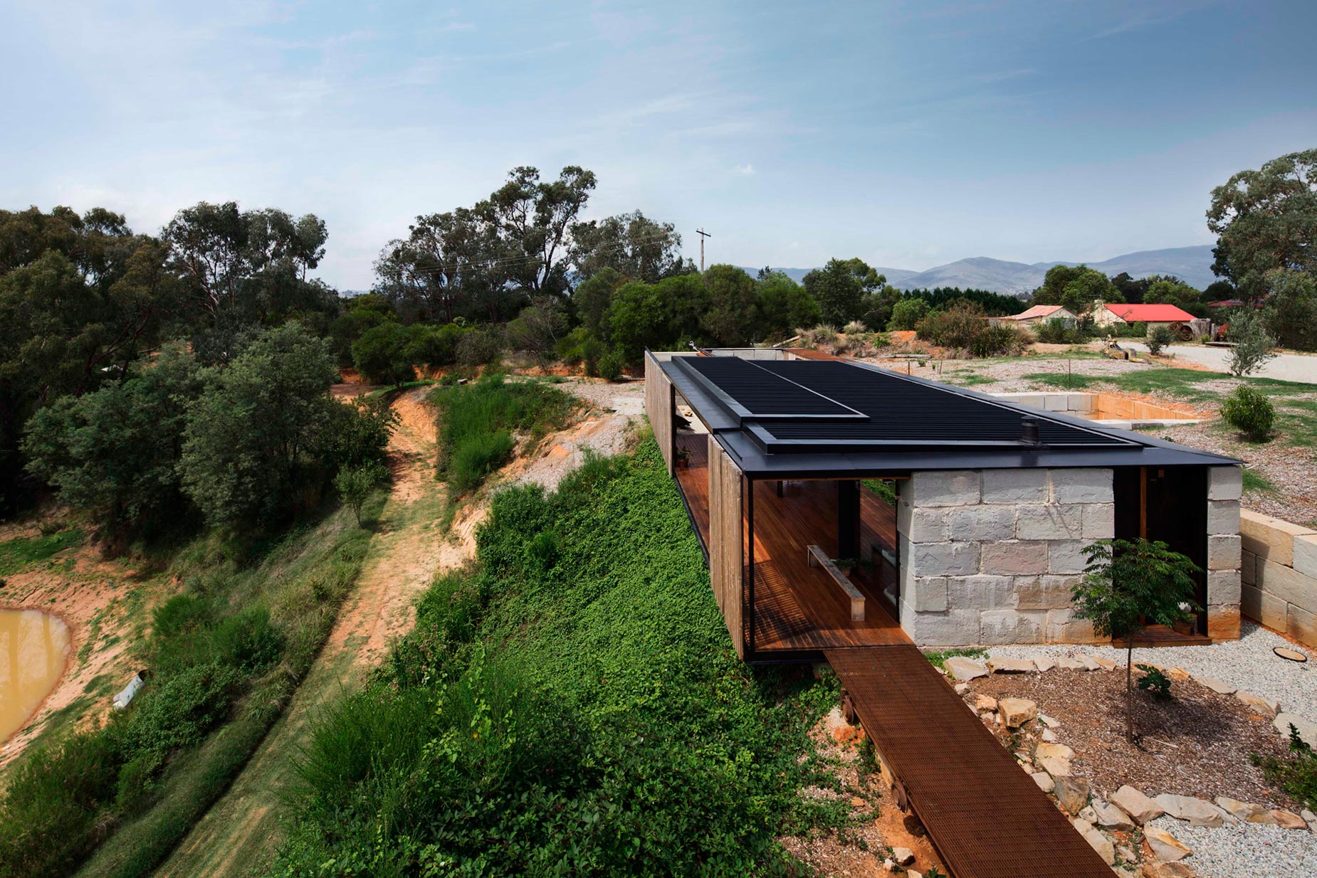 A Modern House Built From Reclaimed Concrete Blocks and Rough-Sawn Wood in Yackandandah, Australia by ARCHIER (2)