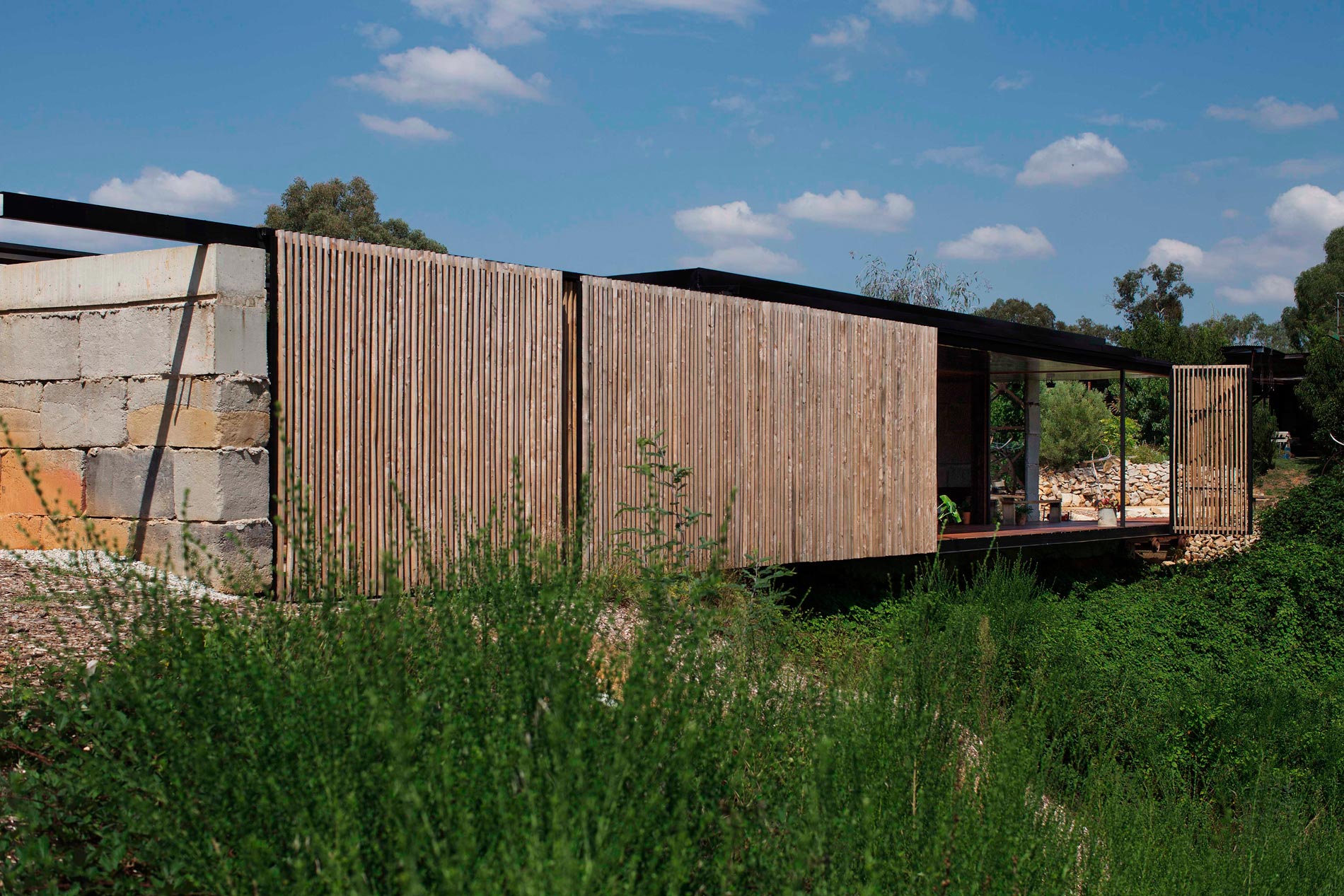 A Modern House Built From Reclaimed Concrete Blocks and Rough-Sawn Wood in Yackandandah, Australia by ARCHIER (8)