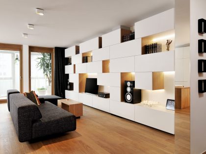 An Elegant L-Shaped Apartment with Walls of Modular Shelving and Storage in Ljubljana by Lidija Dragisic (1)