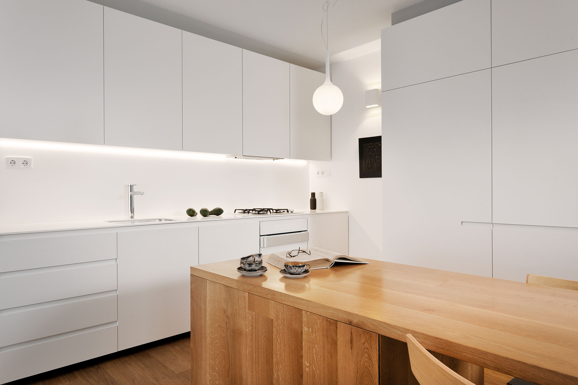 An Elegant L-Shaped Apartment with Walls of Modular Shelving and Storage in Ljubljana by Lidija Dragisic (10)