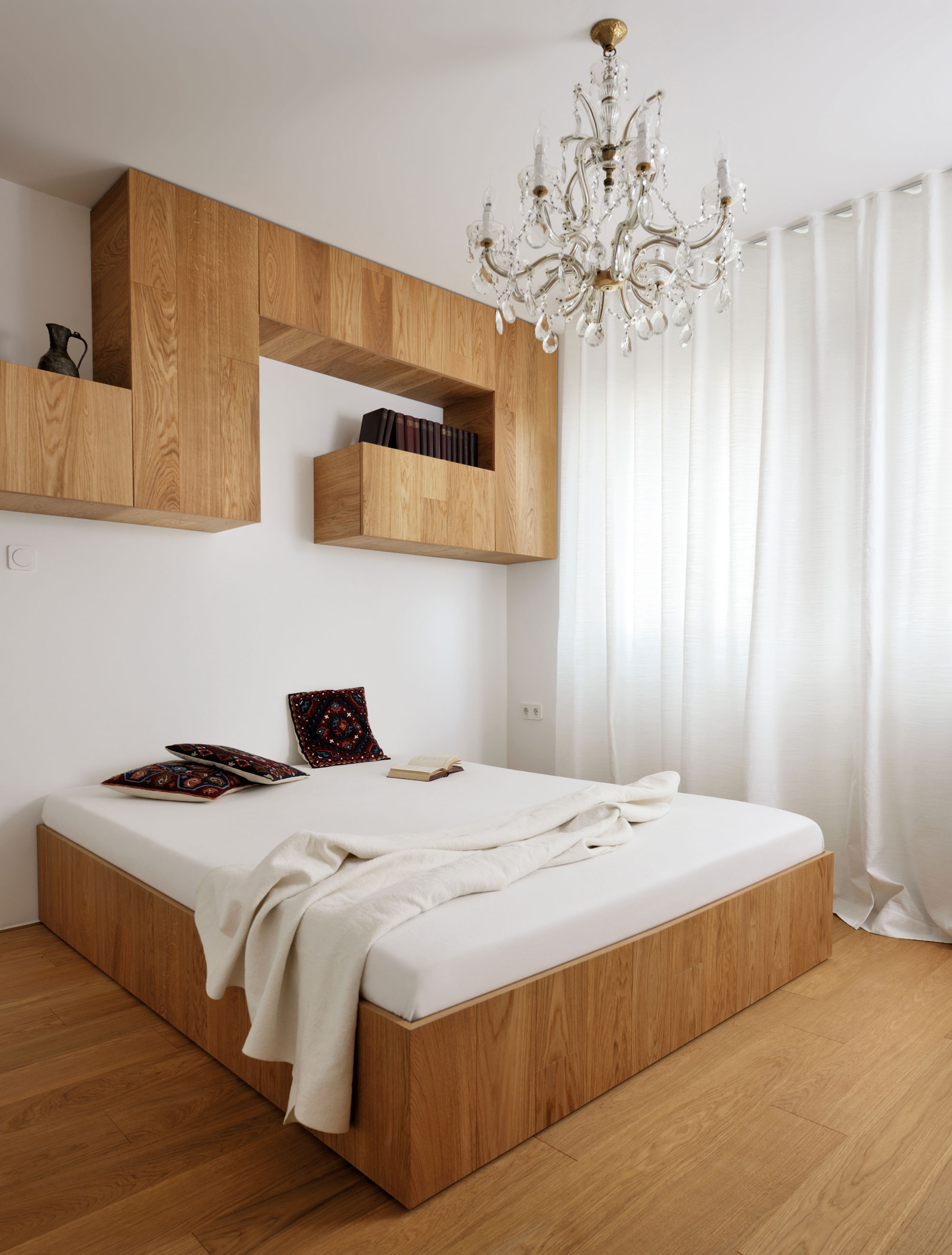 An Elegant L-Shaped Apartment with Walls of Modular Shelving and Storage in Ljubljana by Lidija Dragisic (11)