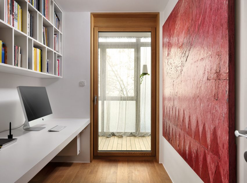 An Elegant L-Shaped Apartment with Walls of Modular Shelving and Storage in Ljubljana by Lidija Dragisic (16)