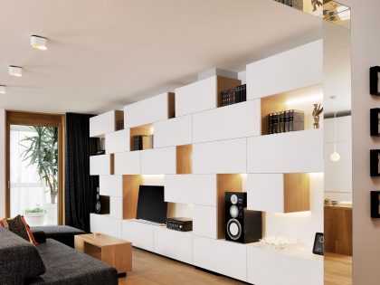 An Elegant L-Shaped Apartment with Walls of Modular Shelving and Storage in Ljubljana by Lidija Dragisic (2)