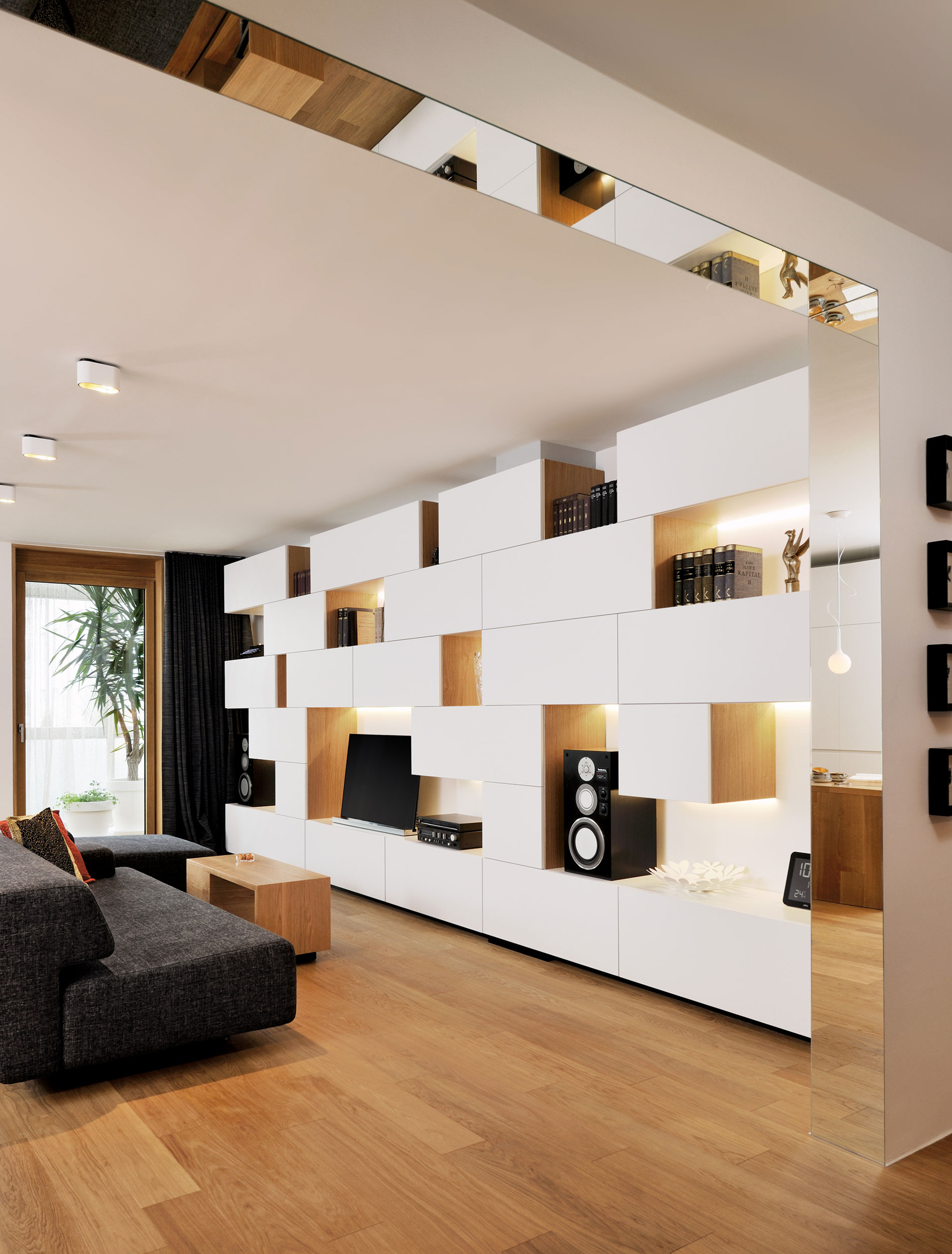 An Elegant L-Shaped Apartment with Walls of Modular Shelving and Storage in Ljubljana by Lidija Dragisic (2)