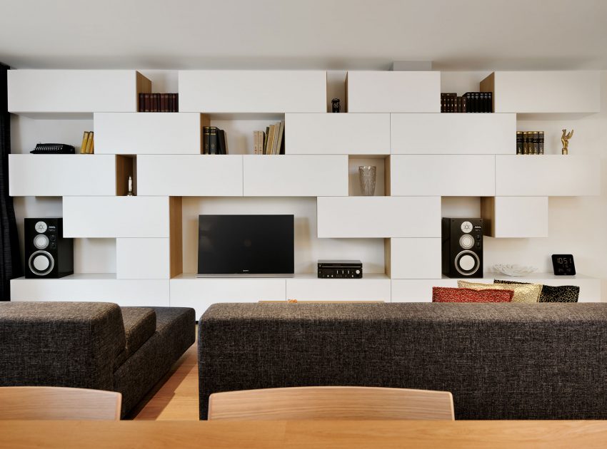 An Elegant L-Shaped Apartment with Walls of Modular Shelving and Storage in Ljubljana by Lidija Dragisic (4)