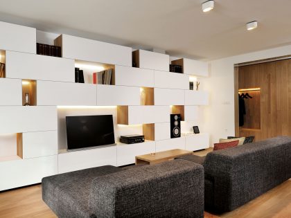 An Elegant L-Shaped Apartment with Walls of Modular Shelving and Storage in Ljubljana by Lidija Dragisic (5)