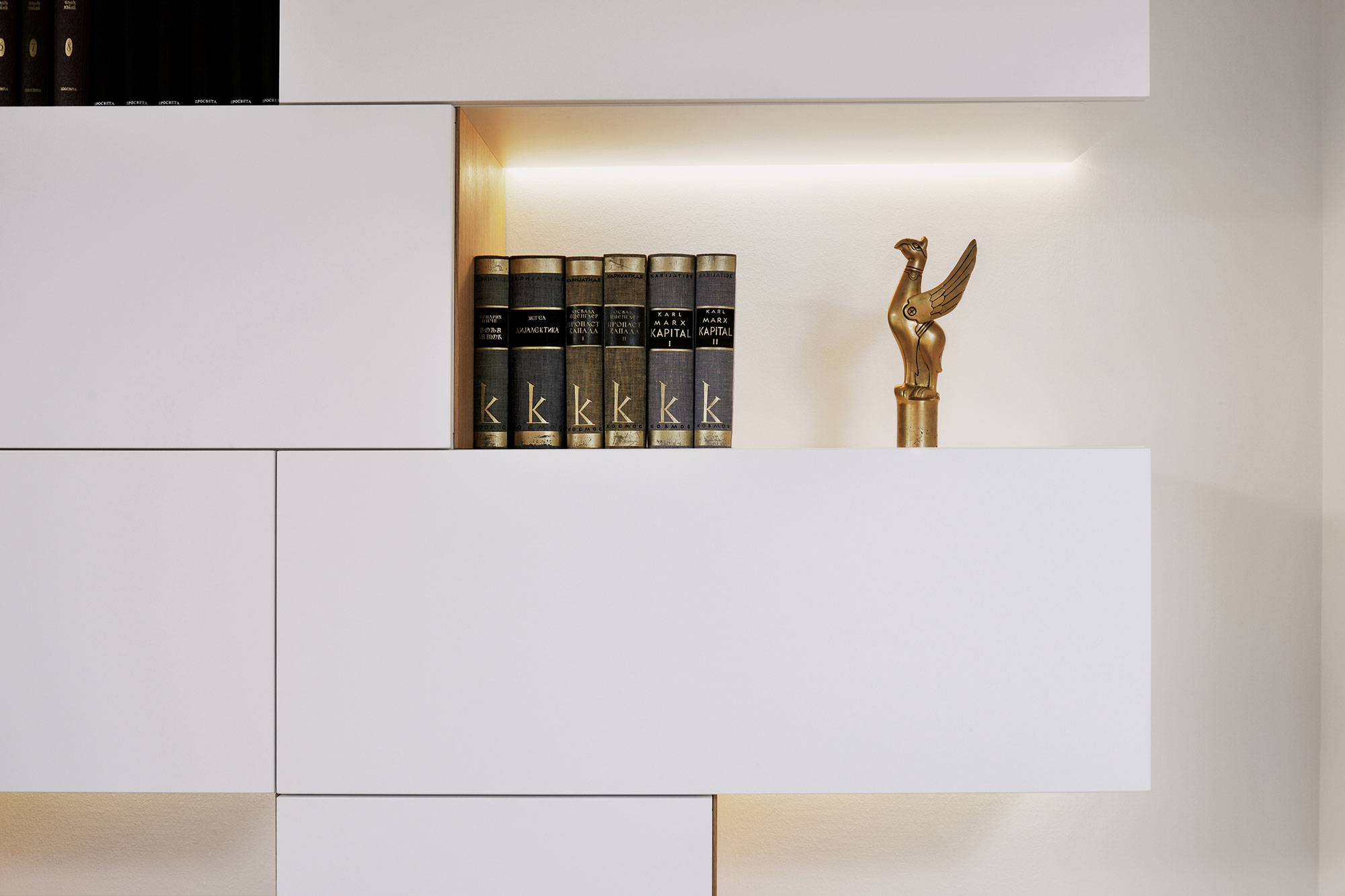 An Elegant L-Shaped Apartment with Walls of Modular Shelving and Storage in Ljubljana by Lidija Dragisic (6)