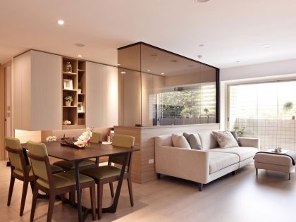 A Small Apartment Characterized by Shades of White and Brown Interiors in Taipei