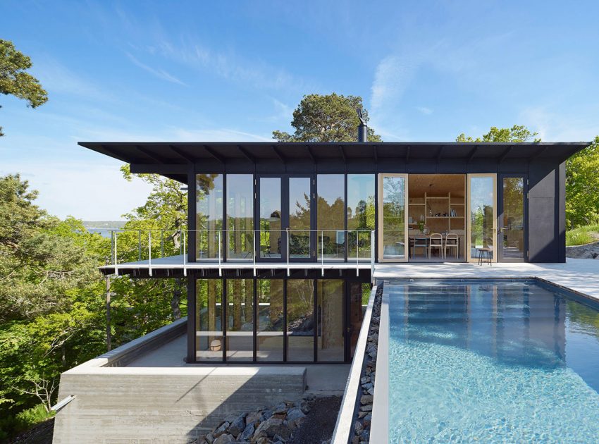 A Small Steel, Wood and Glass House Built on Steep Slope with Infinity Pool in Aspvik by Andreas Martin-Löf Arkitekter (1)