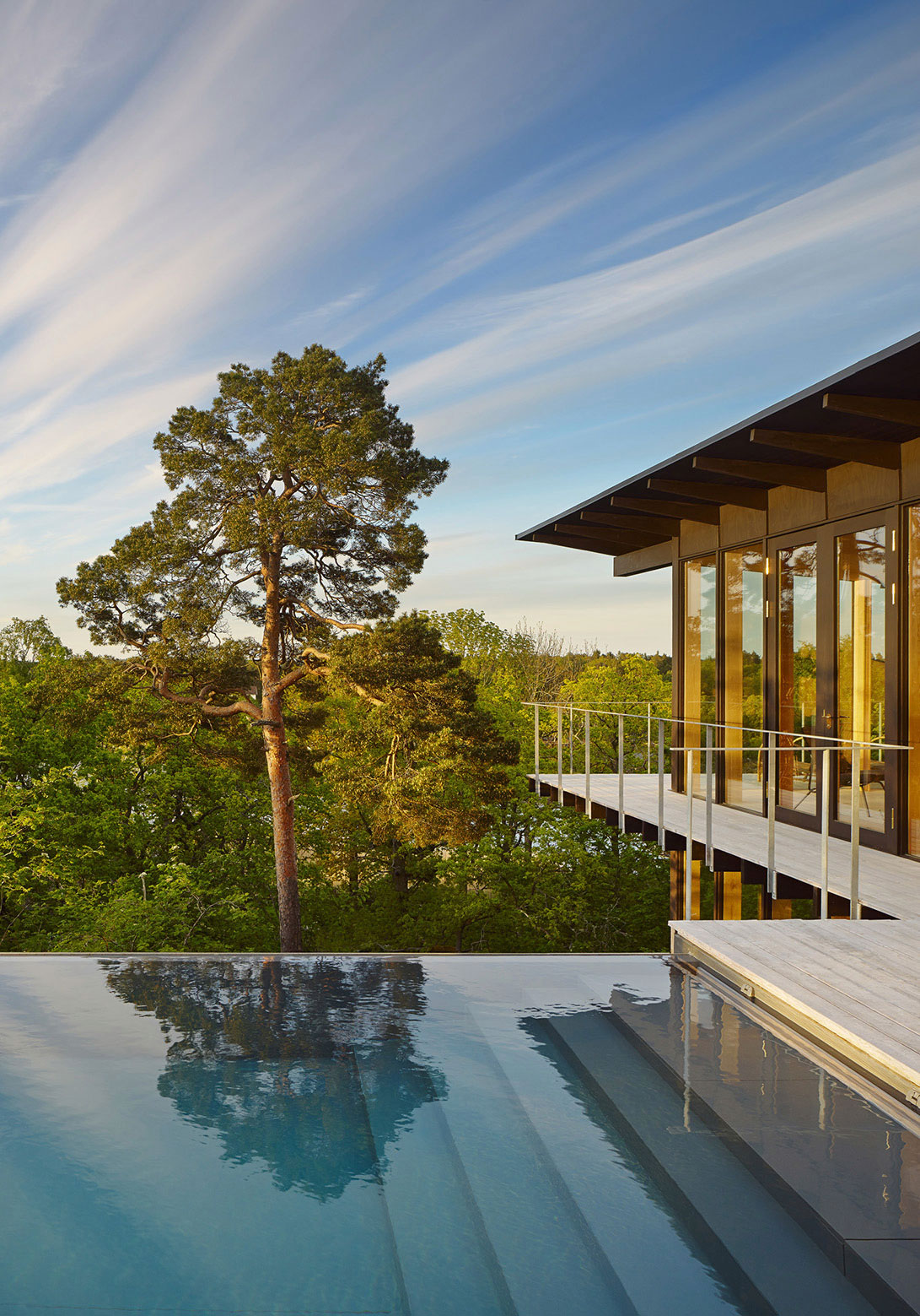 A Small Steel, Wood and Glass House Built on Steep Slope with Infinity Pool in Aspvik by Andreas Martin-Löf Arkitekter (2)