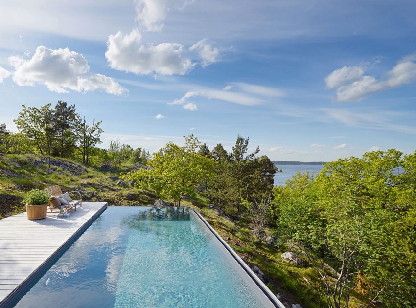 A Small Steel, Wood and Glass House Built on Steep Slope with Infinity Pool in Aspvik by Andreas Martin-Löf Arkitekter (3)