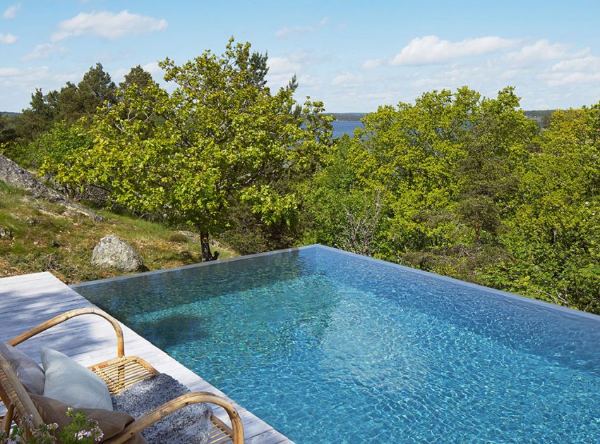 A Small Steel, Wood and Glass House Built on Steep Slope with Infinity Pool in Aspvik by Andreas Martin-Löf Arkitekter (4)