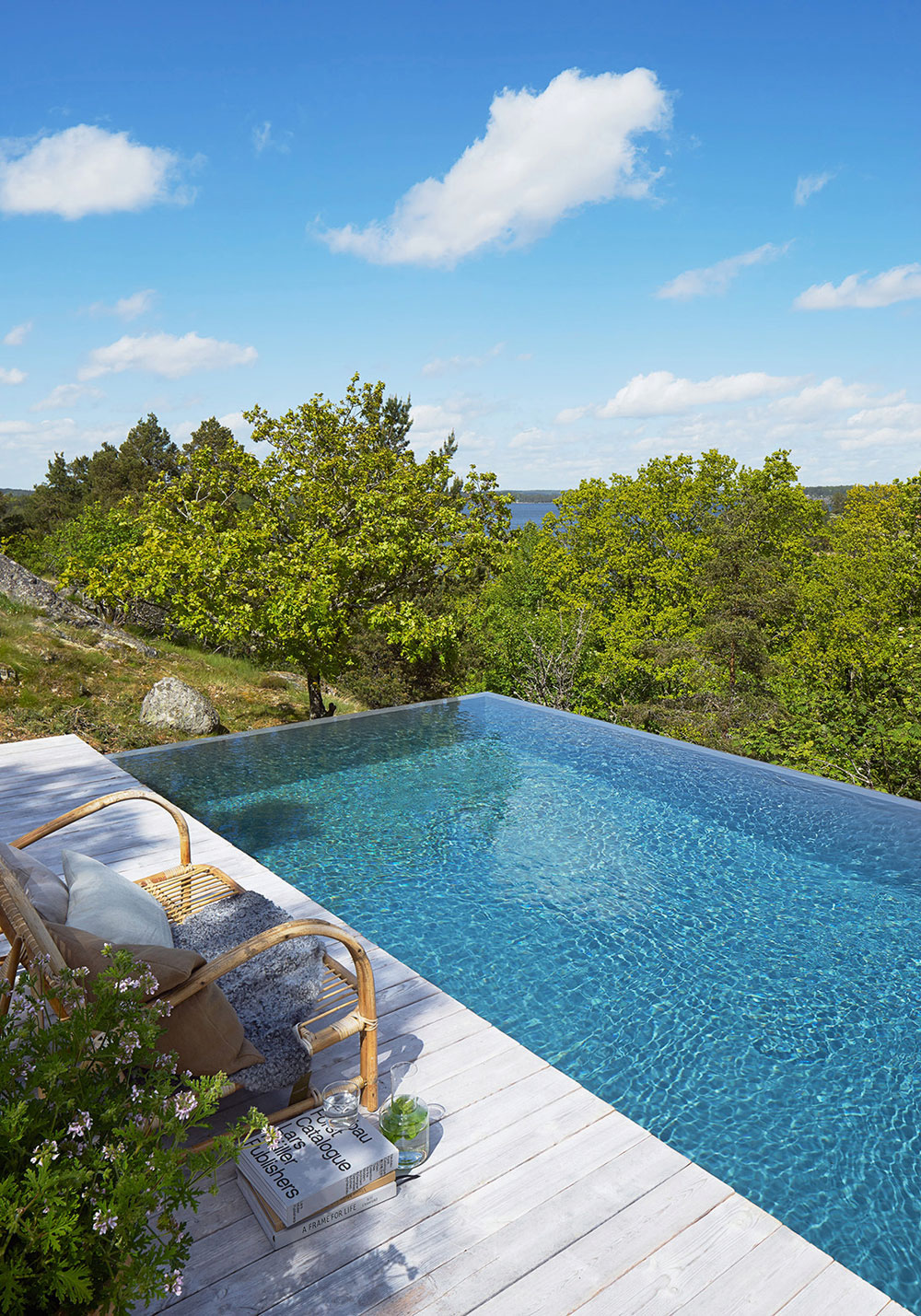 A Small Steel, Wood and Glass House Built on Steep Slope with Infinity Pool in Aspvik by Andreas Martin-Löf Arkitekter (4)