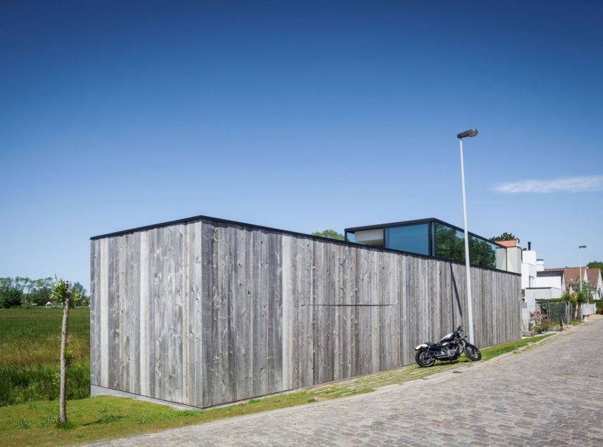 A Spacious Contemporary Home Finished with Concrete, Metal Mesh and Glass in Knokke by Govaert & Vanhoutte Architects (4)