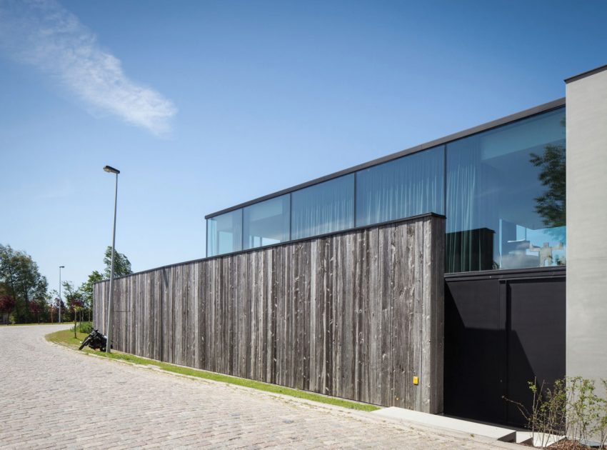 A Spacious Contemporary Home Finished with Concrete, Metal Mesh and Glass in Knokke by Govaert & Vanhoutte Architects (6)