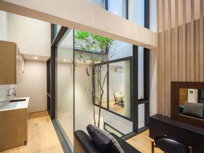 A Spacious and Stylish Modern House for a Big Family in Suriya Wong, Thailand by IDIN Architects (18)