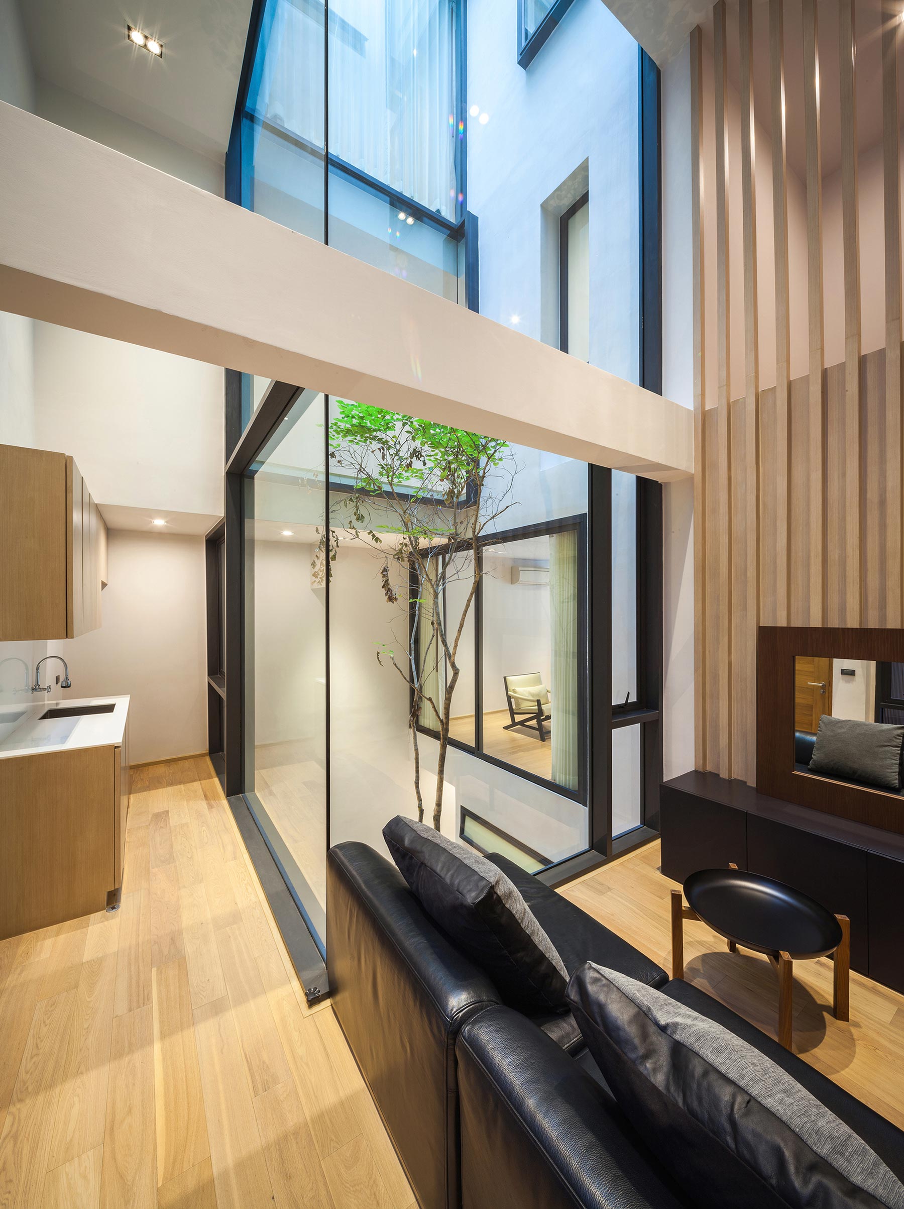 A Spacious and Stylish Modern House for a Big Family in Suriya Wong, Thailand by IDIN Architects (18)