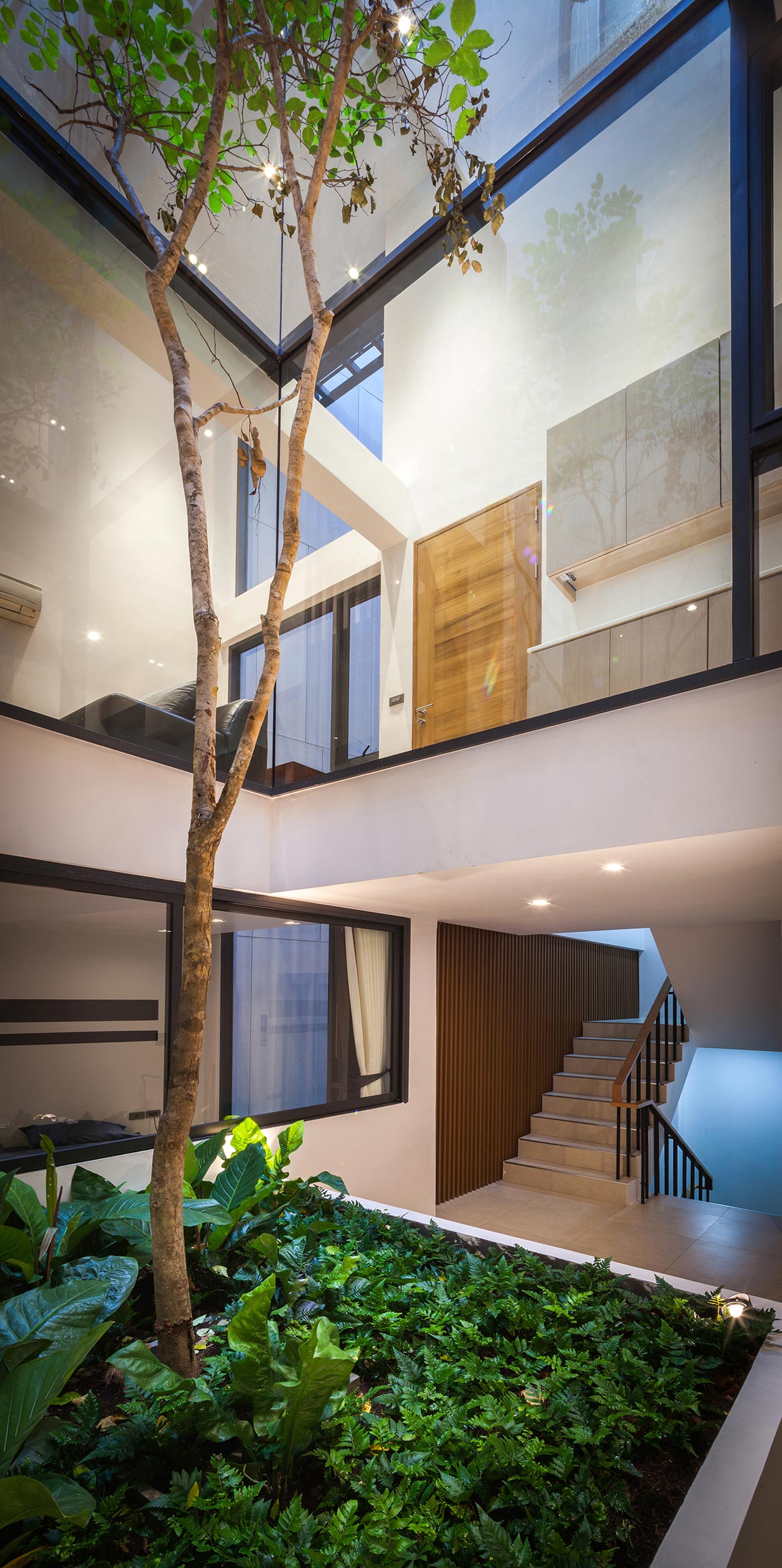 A Spacious and Stylish Modern House for a Big Family in Suriya Wong, Thailand by IDIN Architects (6)
