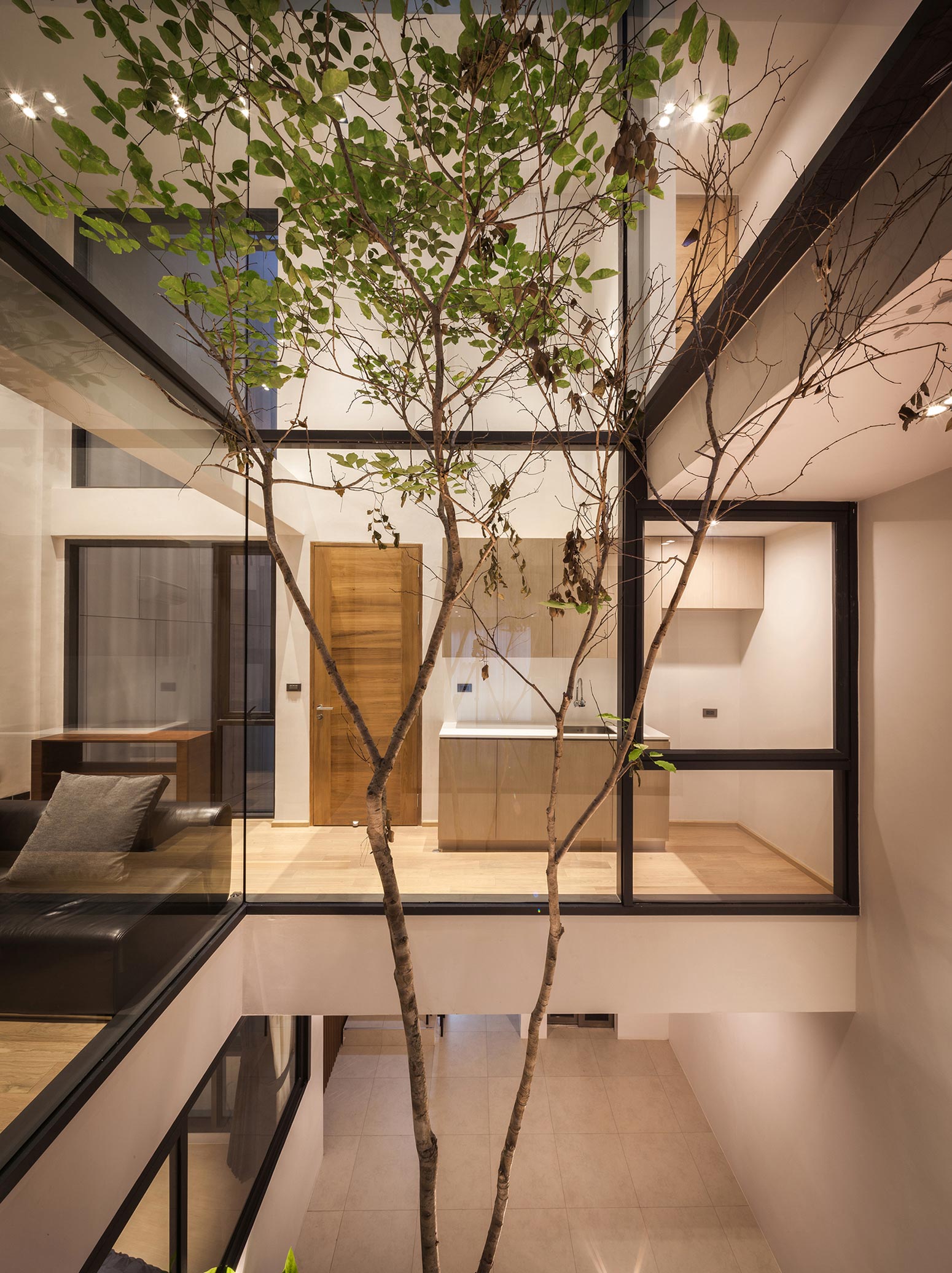 A Spacious and Stylish Modern House for a Big Family in Suriya Wong, Thailand by IDIN Architects (8)